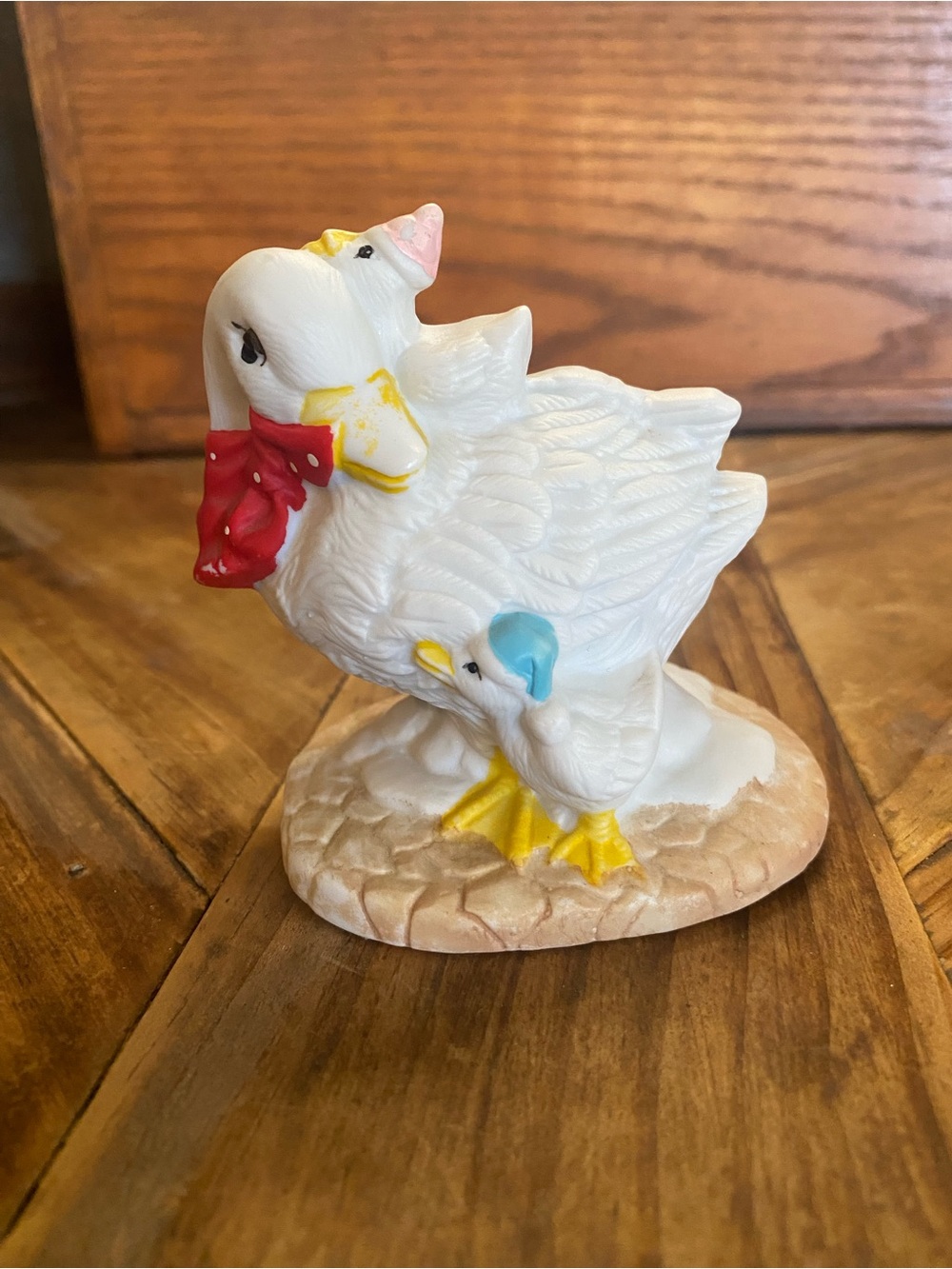 White Ceramic Mother and Baby Duck Figurine with Red Bow and Blue Bonnet